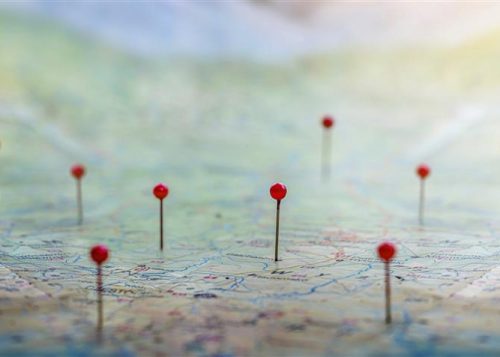 Red pins on a map.
